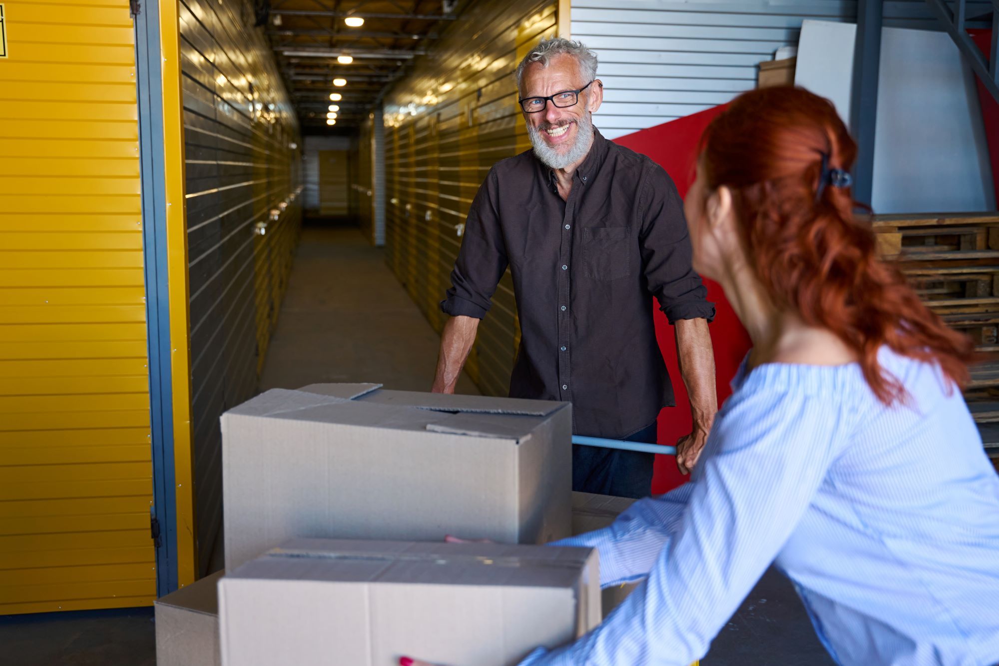 smiling-man-with-cargo-cart-with-boxes-in-warehous-2025-03-07-20-35-16-utc (2) | Best Dubai Storage home