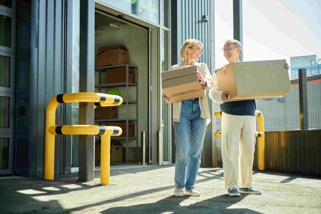 caucasian-couple-carrying-cardboard-boxes-outside-2025-09-01-14-10-22-utc 2 | Best Dubai Storage e-commerce storage