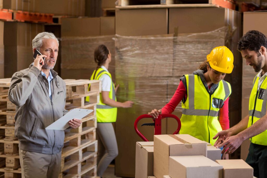 warehouse-manager-and-workers-preparing-a-shipment-2025-04-05-06-04-14-utc 2 | Best Dubai Storage best dubai storage