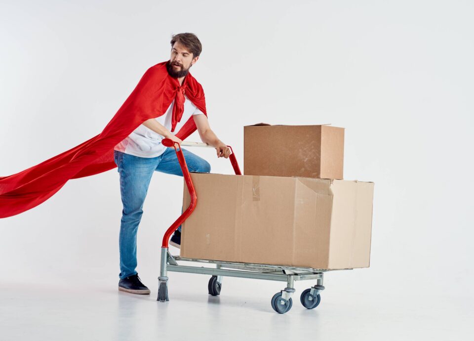 courier-in-red-cloak-superhero-cardboard-boxes-and-2025-03-10-18-04-44-utc 2 | Best Dubai Storage movers in jebel ali