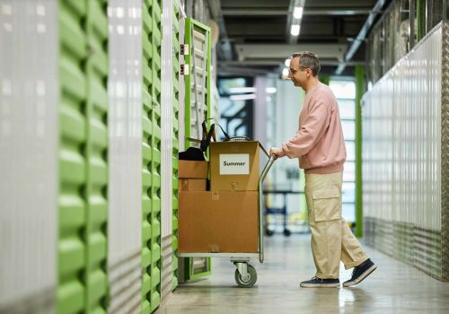 middle-aged-man-storing-boxes-in-self-storage-faci-2026-03-20-04-10-58-utc-1.jpg