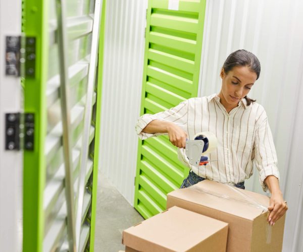 woman-packing-boxes-in-storage-facility-2026-01-08-07-07-09-utc-1.jpg